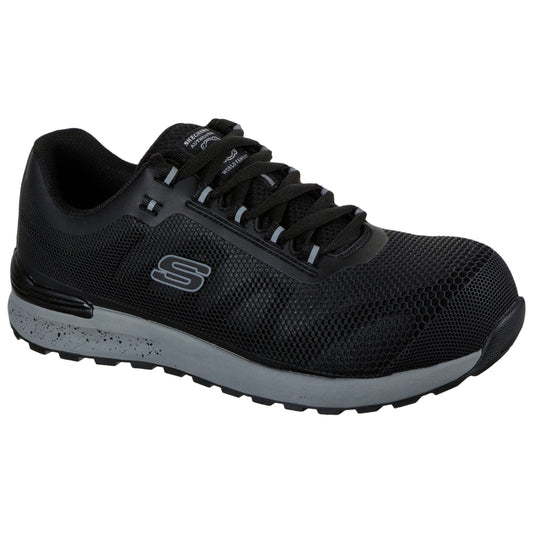 A black athletic shoe features a textured mesh surface and a rubber sole. It sits on a white background, showcasing its design and detailing, suitable for active wear.