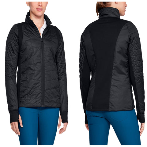 A black jacket with a quilted front and solid back is worn by a woman who is standing and slightly turning. The environment appears casual and suitable for activewear.