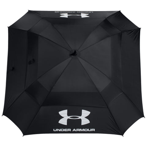 A large black umbrella with the Under Armour logo is positioned upside down displaying its canopy structure the umbrella appears ready for use in rainy or sunny weather conditions.