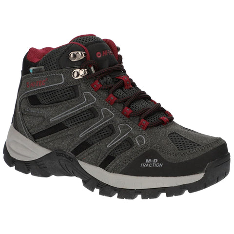 A sturdy gray hiking boot features red accents and black details lacing up with metallic eyelets designed for outdoor traction positioned against a plain white background.