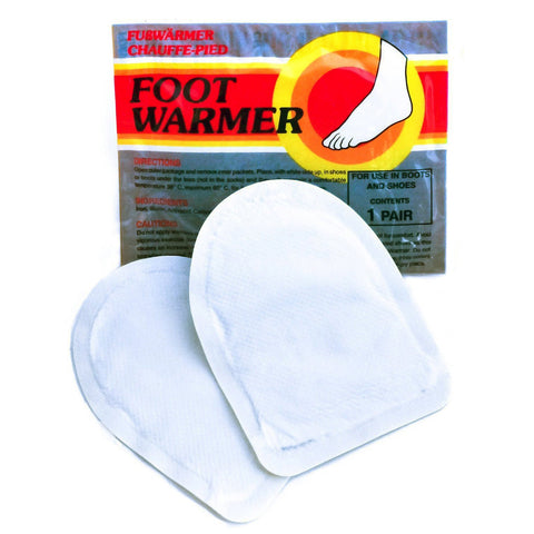 Foot warmers are white heating pads displayed in front of a colorful packaging that includes directions for use ingredients and cautions indicating their purpose is to provide warmth for cold feet.