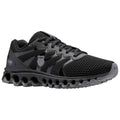 Sporting shoe featuring a black mesh upper with shiny accents and a distinctive cushioned sole designed for comfort and support suitable for running or athletic activities in various environments