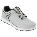 A gray athletic shoe with a textured upper and contrasting black accents is positioned at an angle emphasizing its design features like laces and molded traction outsole suitable for sports activities.