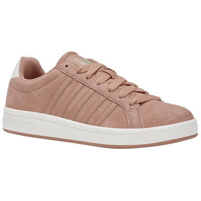 A brown suede sneaker with white accents displays a lace-up design and textured stripes on the side in a simple clean aesthetic suitable for casual wear.