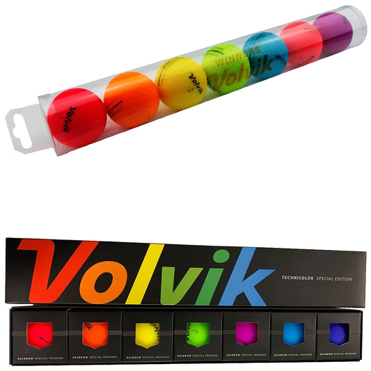 A clear tube holds brightly colored golf balls labeled Volvik and winners each resting above a black box featuring multiple colorful compartments with the words Rainbow Special Package and Volvik prominently displayed.