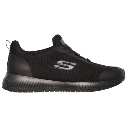 A black athletic shoe with a mesh upper and rubber sole is displayed. It features prominent branding on the side and is positioned against a neutral background.