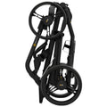 A compact folding stroller is in a closed position featuring black metal frames and large wheels demonstrating efficient storage designed for convenience in urban settings.