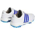 White athletic shoes with blue accents feature a textured sole designed for grip and performance. They are positioned against a plain background emphasizing their design and color scheme.