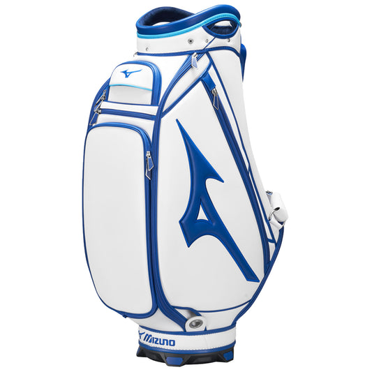 A white and blue golf bag stands upright featuring multiple zipped pockets for storage the bag is designed for easy transport on a golf course and showcases the Mizuno logo.