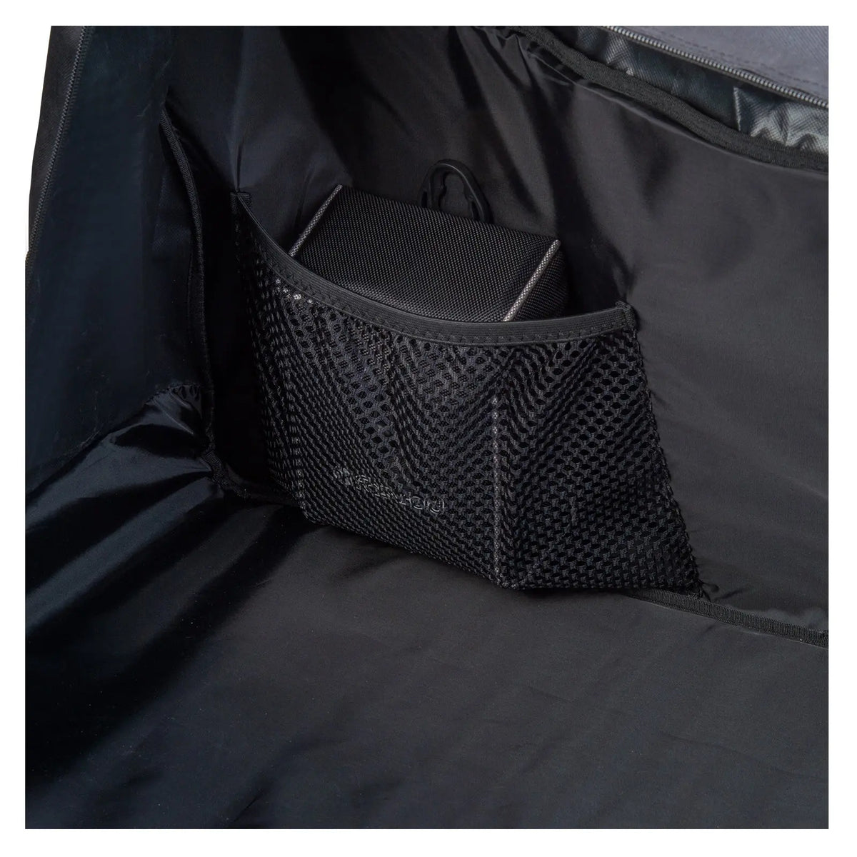 A black mesh pouch holds a small rectangular object inside a larger black bag the interior is smooth and dark with little visibility around the pouch