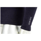 A dark long-sleeve shirt is displayed on a silver mannequin with the brand name Zerofit printed in white on the sleeve highlighting the garment's texture and fit.