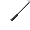 A black handled cooking utensil with a long handle and a flat blade is positioned diagonally against a plain white background suggesting it is meant for use in food preparation