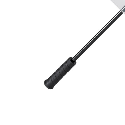 A black handled cooking utensil with a long handle and a flat blade is positioned diagonally against a plain white background suggesting it is meant for use in food preparation