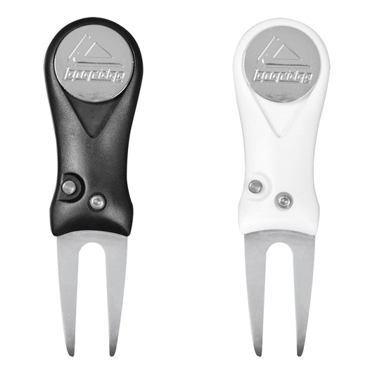 A black and white divot repair tool sits side by side featuring a forked end for removing soil with buttons on the handle designed for golf course maintenance.