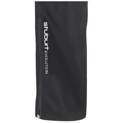 A black golf rain pant is displayed featuring a zippered pocket and the text "stuburt EVOLUTION" printed vertically in white on the side. The fabric appears smooth and functional for wet conditions.