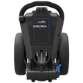 A black electric golf trolley showcases a compact design with two large wheels and a handle for maneuvering positioned centrally. It appears ready for use on a golf course. The brand and model label reads PowaKaddy MICRA.