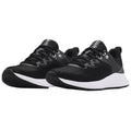 A pair of black athletic shoes with a textured surface and white soles sits side by side displaying laces and eyelets in a minimalist setting designed for sports or casual wear.
