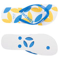 A pair of flip-flops features a white base adorned with yellow and blue leaf patterns and blue straps resting atop a smooth white sole in a well-lit setting.