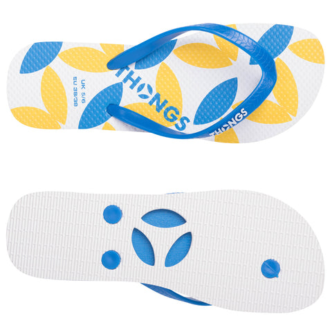 A pair of flip-flops features a white base adorned with yellow and blue leaf patterns and blue straps resting atop a smooth white sole in a well-lit setting.