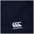 A navy fabric features a white embroidered logo of three stylized overlapping C's with the word Canterbury below suggesting a sportswear or athletic context.