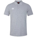 A gray polo shirt is displayed with a buttoned collar short sleeves and a logo on the left chest area the background is plain white