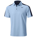A light blue polo shirt with short sleeves is displayed prominently. It features a buttoned collar and contrasting dark navy sections on the shoulders. The brand logo is positioned on the left side.