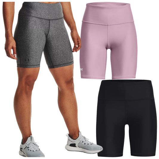 Three pairs of athletic shorts are displayed with one pair worn by a person showing a gray pair on the left a pink pair in the center and a black pair on the right in an indoor setting.