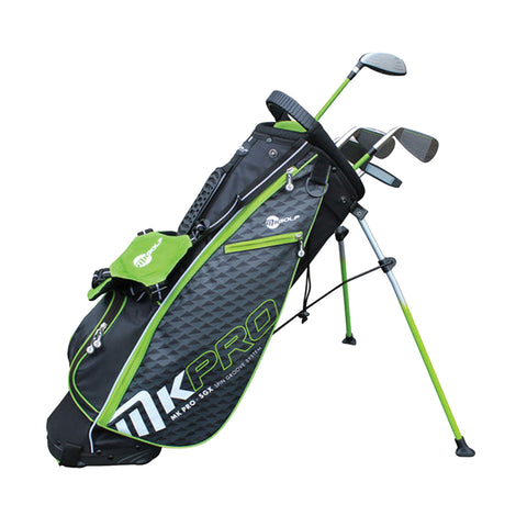 A golf bag is standing upright with clubs partially visible inside. It features a black and green design with visible branding and zippers, situated in a neutral background.