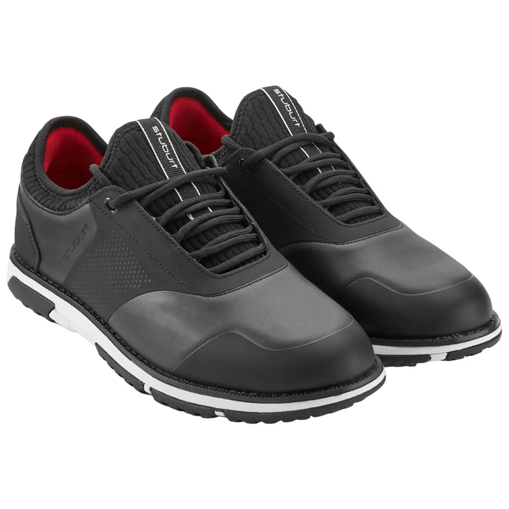 Black athletic shoes are positioned side by side with laces threaded and the interior showcasing a red lining against a plain background, highlighting their design and style suitable for active wear.