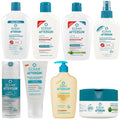 A variety of Ecran Aftersun skincare products are arranged on a flat surface including lotions and creams labeled for soothing and repairing skin after sun exposure.
