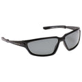 Sunglasses are resting with dark tinted lenses providing a sleek black frame that suggests a sporty design suitable for outdoor activities or bright environments.