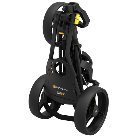 A black golf push cart is folded compactly with two large wheels positioned at the back and a handle at the front showcasing a sturdy frame designed for easy transport and storage.