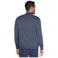 A man wearing a dark blue sweater stands with his back to the viewer in a neutral setting, showcasing the garment’s design and fit without any prominent distractions surrounding him.