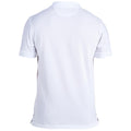 A plain white polo shirt sits upright showing the back side with a collar short sleeves and side slits its smooth fabric reflects light in a neutral setting