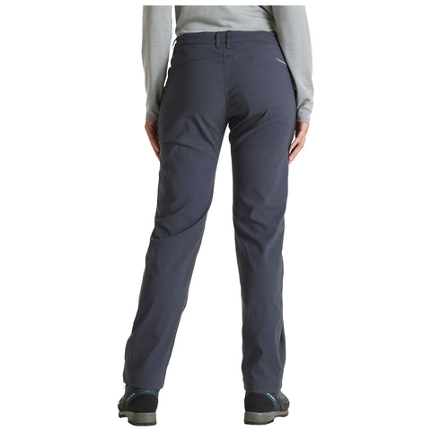 Gray outdoor pants are worn by a person standing with their back facing the viewer in a neutral setting suggesting comfort and readiness for activities in nature.