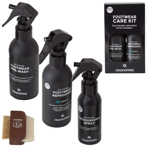 Three eco-friendly spray bottles labeled as footwear pre-wash footwear re-profiler and deodorising spray are arranged beside a wooden brush in a packaged footwear care kit by Craghoppers.