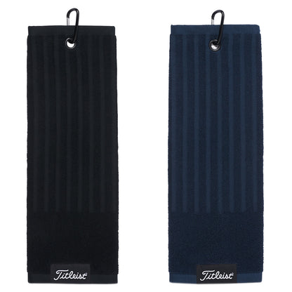 Two golf towels hang side by side displaying textured patterns in black and dark blue highlighting a hook attachment for easy storage and movement during play