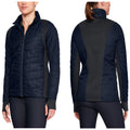 A woman wears a fitted navy jacket with quilted texture and black side panels showcasing a front zipper and high collar in a neutral background.
