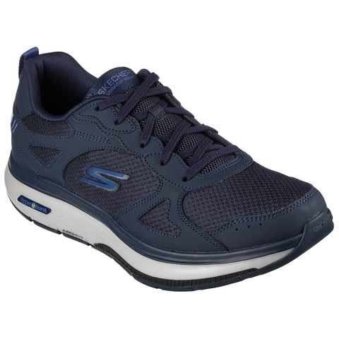 A navy blue athletic shoe with a mesh upper and supportive sole sits upright displaying its lace-up design and logo prominently on the side with a white cushioned midsole for comfort.