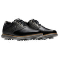 Black leather golf shoes are displayed with a shiny finish and a flexible sole featuring spiked traction. They have a classic design with laces and contrasting gray accents.
