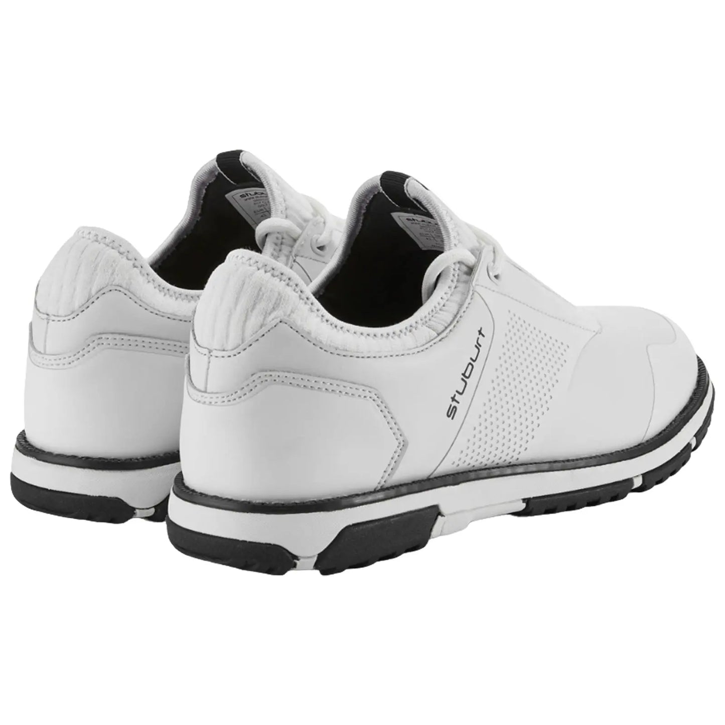 White athletic shoes are positioned upright showing the back and sides featuring smooth leather and perforated sections with black soles set against a simple background