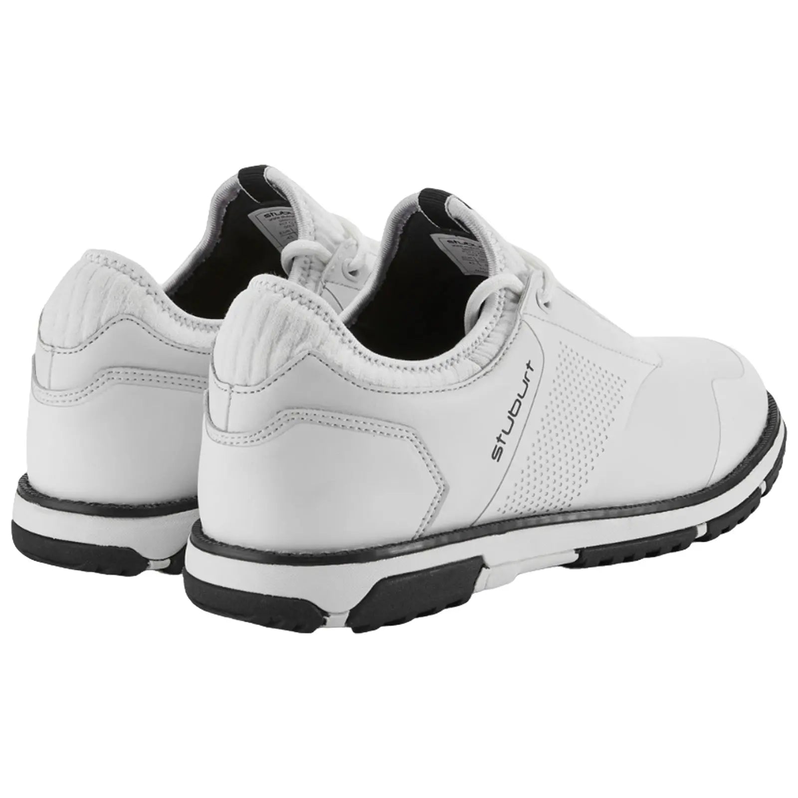 White athletic shoes are positioned upright showing the back and sides featuring smooth leather and perforated sections with black soles set against a simple background