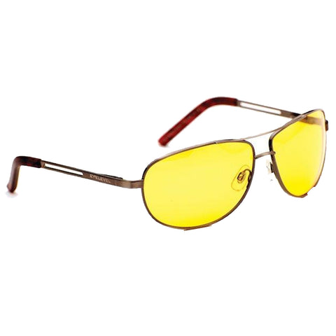 Sunglasses with yellow tinted lenses rest on a flat surface showcasing sleek metallic frames and brown-accented arms highlighting a stylish accessory for sunny environments.