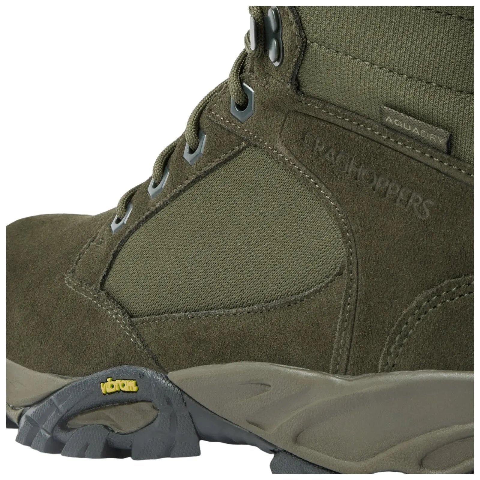 A rugged green boot features suede and textile materials with metal eyelets and a Vibram sole designed for traction and support in outdoor environments.