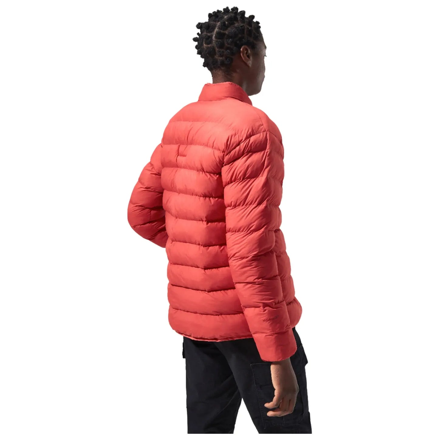 A person wears a vibrant red puffer jacket while standing with their back facing the viewer in a well-lit setting suggesting a casual outdoor atmosphere.