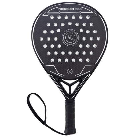 A black paddle racket with a perforated surface and a textured grip is displayed against a white background showing the brand name and model details on its upper section.