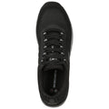 A black athletic shoe is positioned upright with a textured mesh upper and laces visible the surrounding context indicates a neutral background emphasizing the shoe's features and branding.