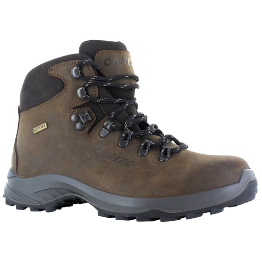 A brown hiking boot with a textured surface laces up securely featuring a reinforced toe and traction sole is positioned against a neutral background ready for outdoor activities.