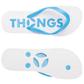 A pair of blue and white flip-flops lies flat with the word "THONGS" prominently displayed on the top surface and textured patterns on the bottom for grip.