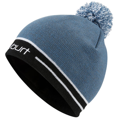 A blue knitted beanie with a black band and white stripes is displayed at an angle showcasing its pom-pom and texture. The beanie is designed for warmth in cold weather.